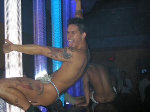 exotic male dancer in sexy pose on stage